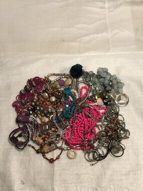 Large and colorful pile of old scrap jewelry for crafts, repair, etc.